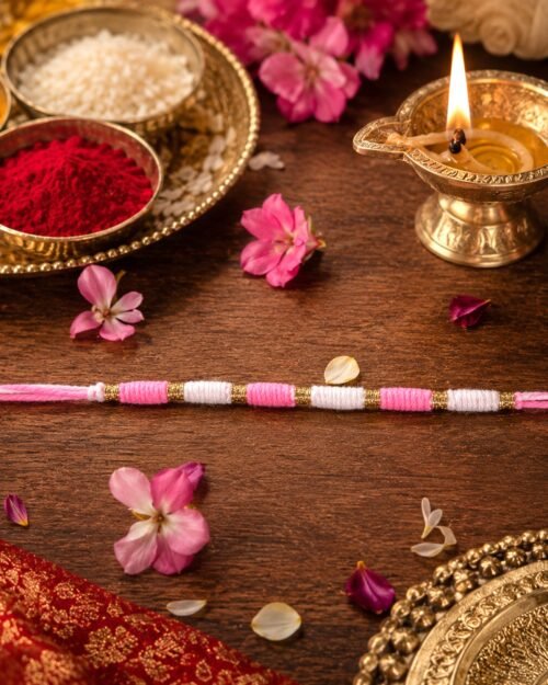 Pink & White Thread Rakhi � Elegant Traditional Beaded Design