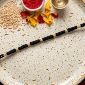 02_d648a62b-5e6e-4891-98dd-7ed271c7d266.jpg Rakhi � Handmade Black Thread with Gold Beads for Raksha Bandhan