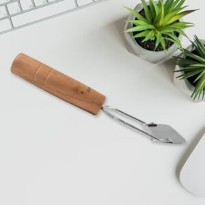 03_f2f15fc1-e888-4bc7-bb1c-59328a3e79b6.jpg Wooden Handle Vegetable Peeler � Ergonomic & Durable Design
