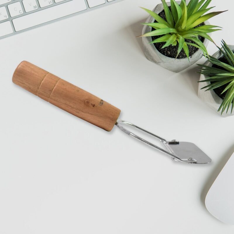 03_f2f15fc1-e888-4bc7-bb1c-59328a3e79b6.jpg Wooden Handle Vegetable Peeler � Ergonomic & Durable Design