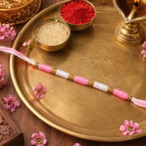 Pink & White Thread Rakhi � Elegant Traditional Beaded Design