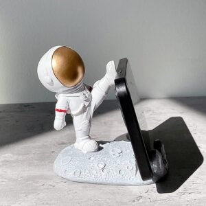 05_8dcc0a34-068b-45d1-9ee5-0c0f1848cbfc.jpg Astronaut Phone Holder � 3D Spaceman Design, Resin | PHOBIA