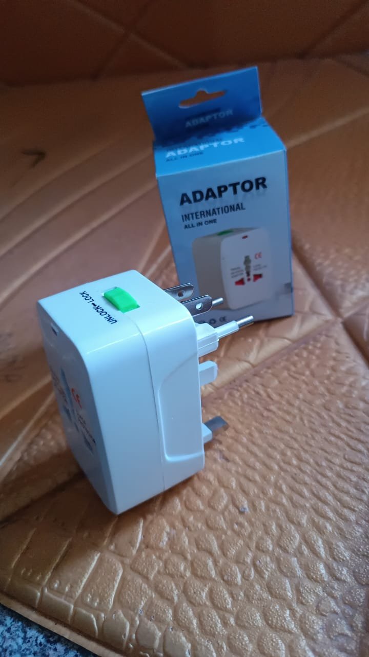 8fdf2b3d-96f6-4c14-be96-e8722b2de79d.jpg Universal Travel Adapter – Compact Surge Protection for 150+ Countries