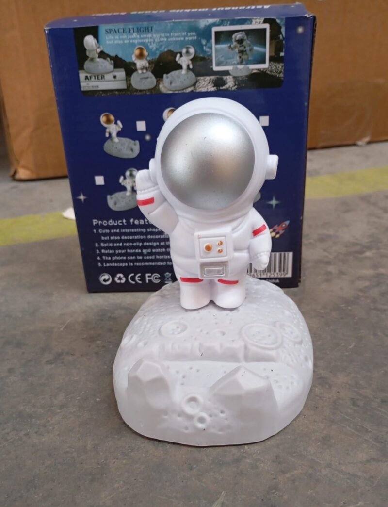 f78a394d-a248-4777-9b66-5a59eff52262.jpg Astronaut Phone Holder � 3D Spaceman Design, Resin | PHOBIA